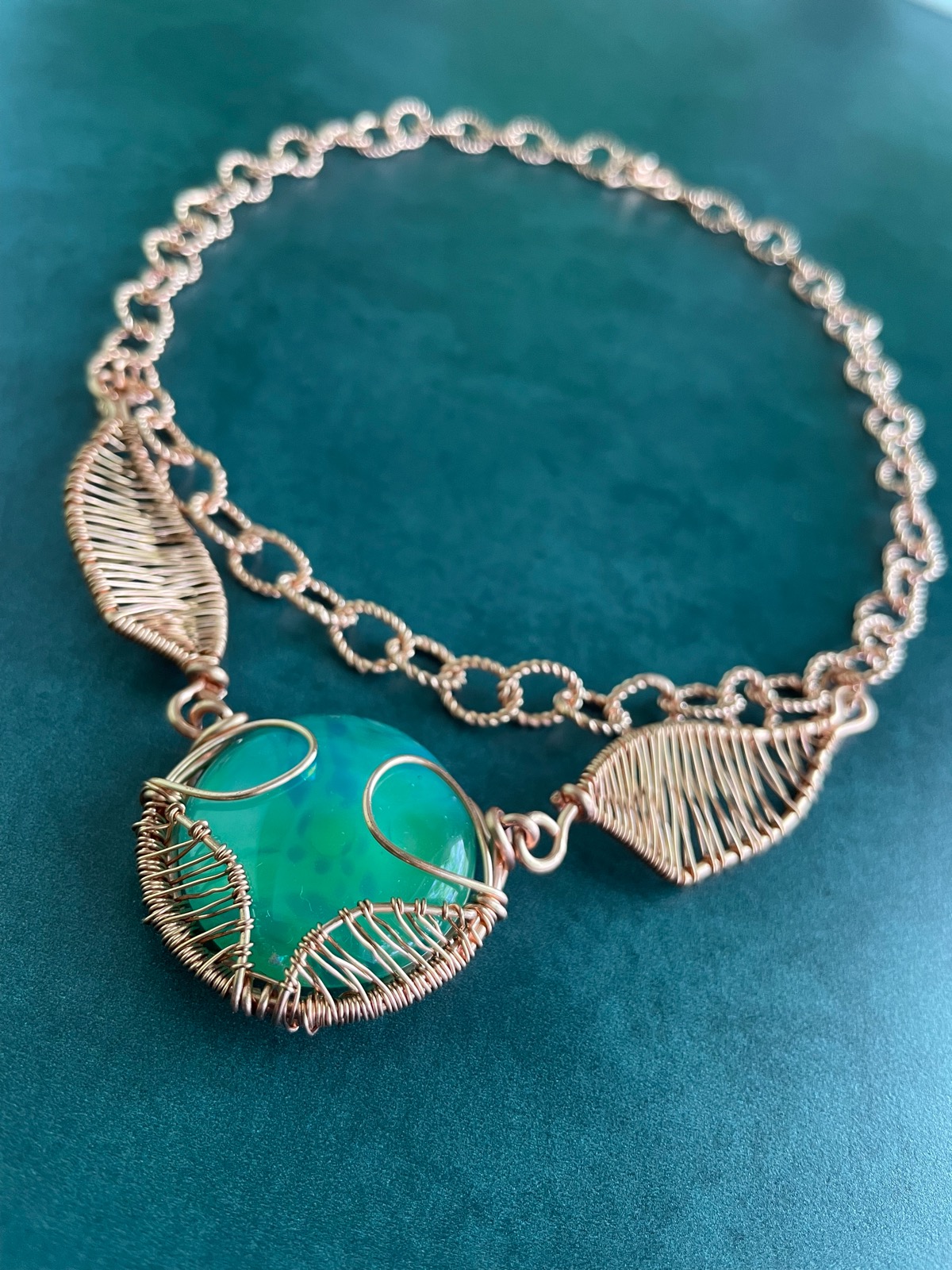 Copper Wire-wrapped green cabochon with wings necklace